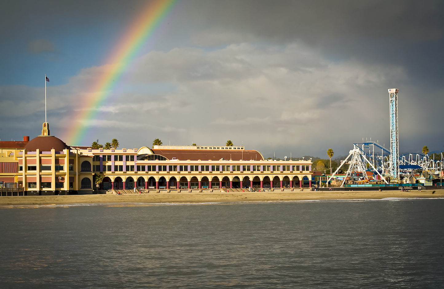 x Santa Cruz Beach and Boardwalk with a rainbow overhead captured from the water
